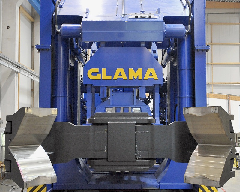 A blue machine with yellow letters spelling "GLAMA".